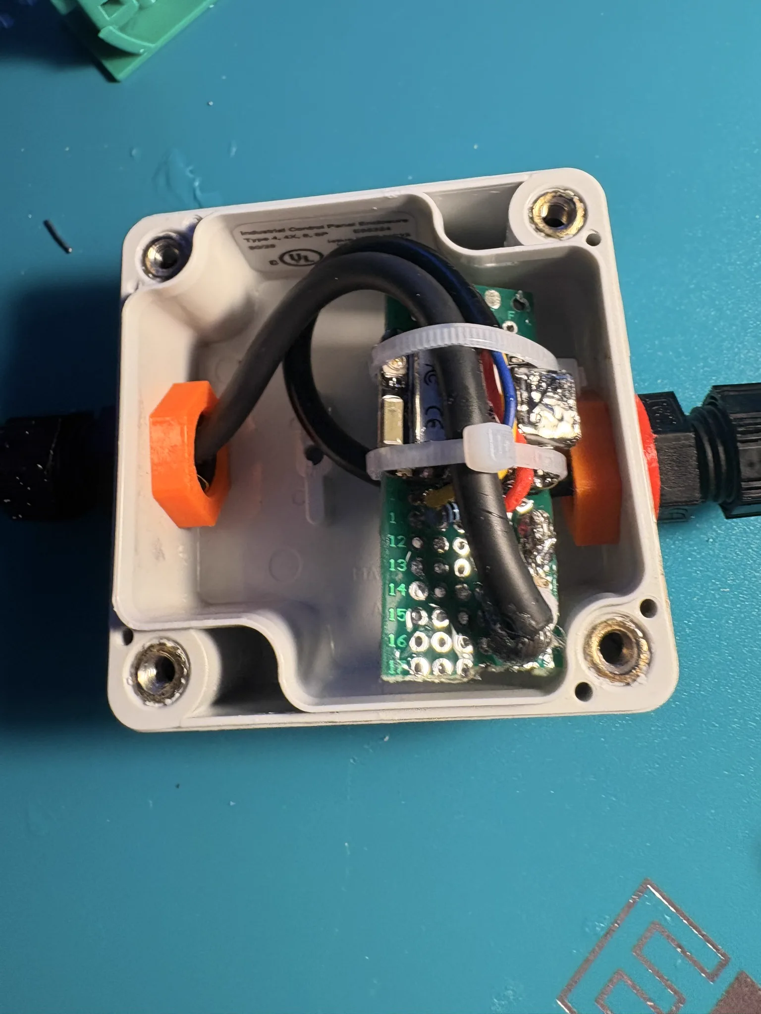 Hand-soldered protoboard and wiring inside the electrical box