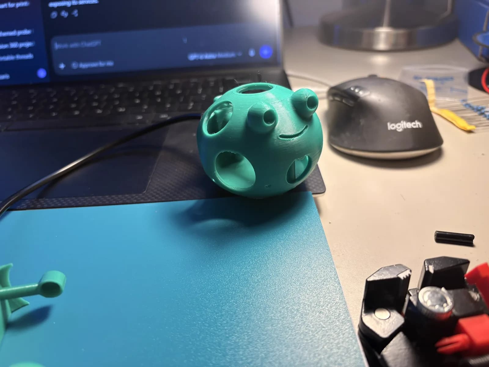 Front view of the frog-shaped sensor enclosure with drainage openings